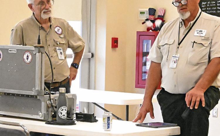 MEMBERS OF LEE COUNTY Amateur Radio Emergency Services (ARES) visited with the Burleson County Community Emergency Response Team (CERT) last Tuesday. CERT is looking at trying to get a grant to set up radio emergency services in Burleson County. Tribune photo by Denise Squier