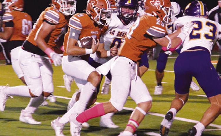 CALDWELL QUARTERBACK COY Becka carries the ball against La Grange in last Friday’s game. -- Tribune photo by Roy Sanders