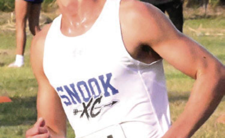 SNOOK’S BARRETT Dudensing won the varsity boys race at Saturday’s Yegua Invitational cross country meet at Overlook Park. Tribune photo by Denise Squier