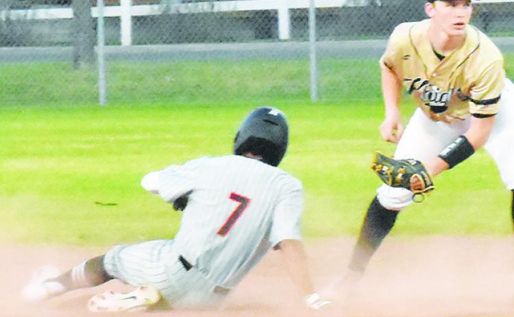 SOMERVILLE’S VICTOR OROZCO slides into second base last Friday against Bellville Faith Academy. -- Tribune photo by Roy Sanders