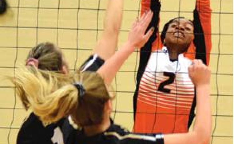 RAMAYA CARTER blocks a hit from Giddings’ Ryan Melcher on Tuesday. Also pictured is Giddings’ Brooklyn Walther.