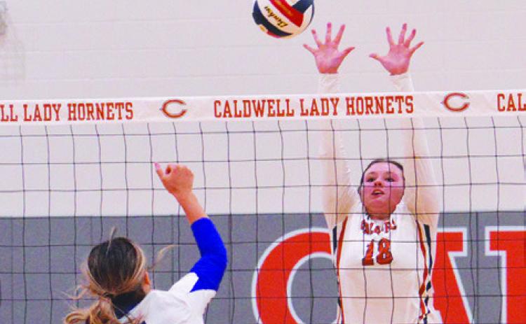 CALDWELL’S KIERSTYN MACIK attempts to block a hit from a Navasota player during the Lady Hornets’ win on Friday at home. Tribune photo by Kimberly Hutcheson