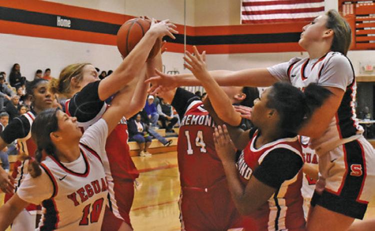LADY YEGUAS CAPRI ALEJANDRO and Abigail Richardson fight with several Bremond players for a rebound during the Somerville-Bremond game last Friday night in Somerville. Tribune photo by Roy Sanders