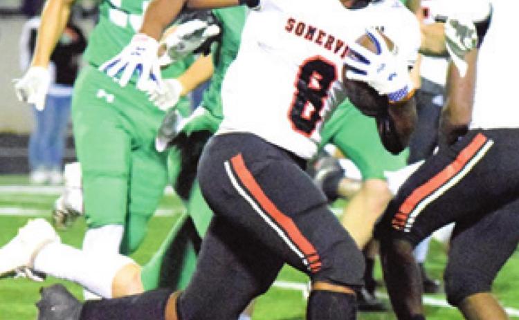 DEVEN GREEN runs with the ball during Somerville’s bi-district game against Eldorado last Thursday night in Burnet.