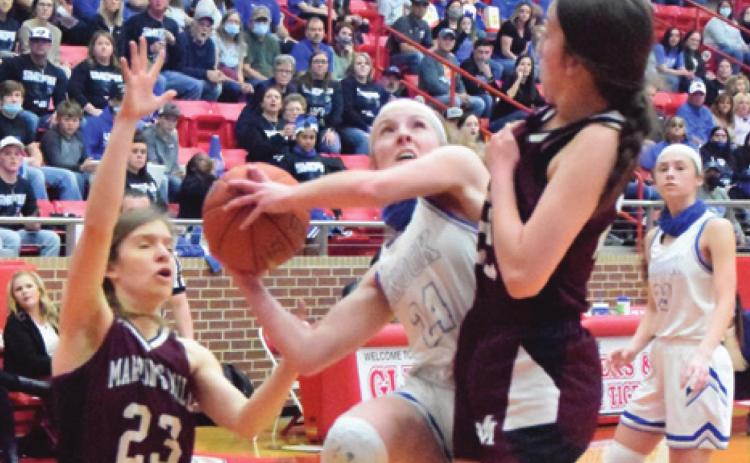 SNOOK’S JAYCIE BRISCO is about to be fouled by Martin’s Mill’s Libby Rogers during the UIL Class 2A State Semifinal game on Saturday. Also defending is Jada Celsur. -- Tribune photo by Denise Squier