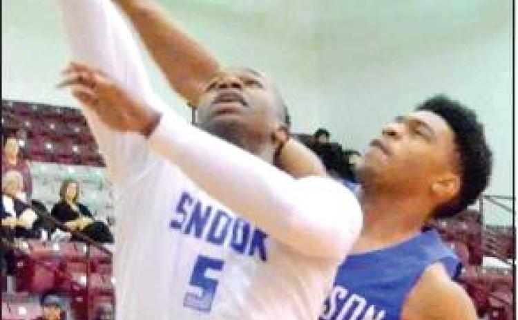QWAN YOUNG of Snook takes a shot against Robinson at the Cameron Tournament. The Bluejays held on to win 56-48.