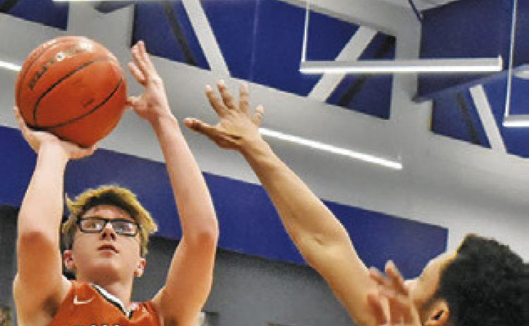 CAYDEN ZBORIL takes a shot against A&amp;M Consolidated JV at the Mumford Tournament. Tribune photo by Roy Sanders