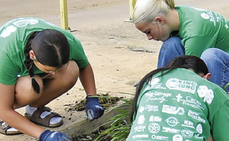 CALDWELL JUNIOR HIGH School students participate in the Big Event service project on Friday, May 15. The students worked on flower beds for this portion at the Caldwell Police Station.