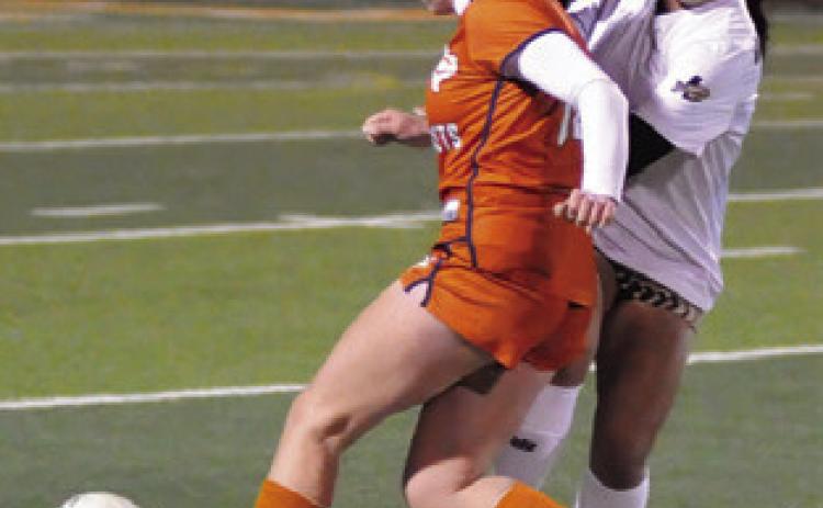 ADELINE HICKS DRIBBLES down the field during the Caldwell-Giddings game last Friday night. Giddings won the game 4-1. Tribune photo by Denise Squier