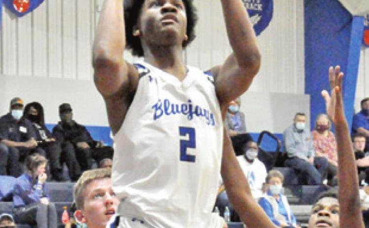 JERMAINE KEARNEY of Snook shoots against Burton. Snook won 44-40.
