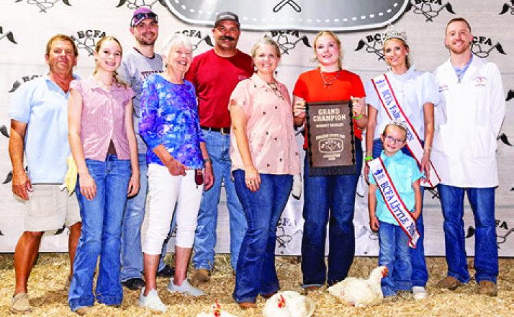 ADDISON HOLCOMB exhibited the Grand Champion Market Broilers at the 2026 Burleson County Fair. She is pictured with Jay Malazzo, Daley Holcomb, Chandler Malazzo, Jeaniene Malazzo, Zack Holcomb, Jill Holcomb, Fair Queen Jolee Telschow, Little Miss Irene Kovar and Jacob Price. Photo courtesy of Jessica Jeffries/Jeffries Livestock Marketing