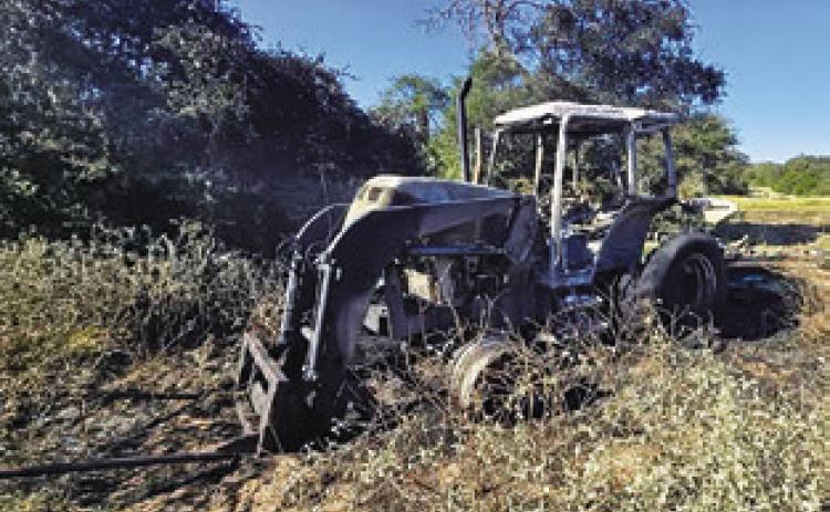 THIS TRACTOR WAS damaged in the fire on County Road 316. Photo courtesy of Caldwell Volunteer Fire Department