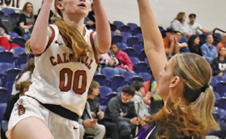 IRELAND MORGAN shoots over a La Grange player during the Caldwell-La Grange game last Friday night at Hornet Gym. Tribune photo by Roy Sanders
