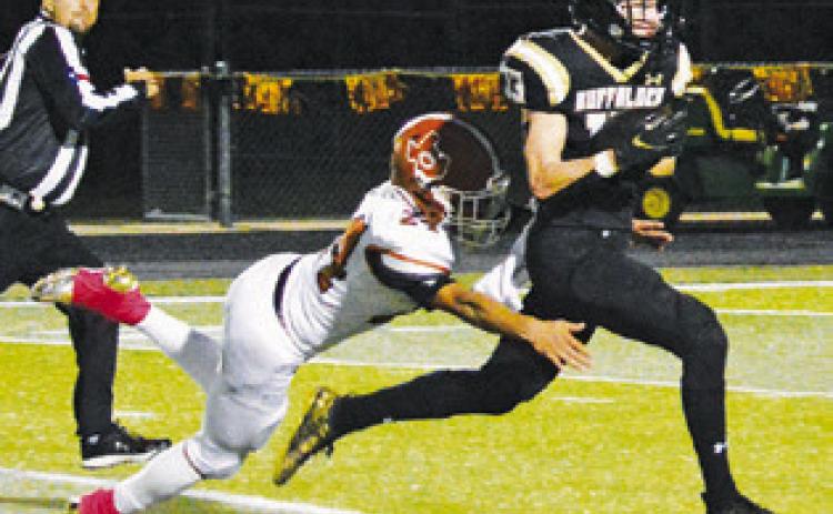 CALDWELL’S AIDAN TORRES dives for this tackle last Friday against Giddings in Giddings. -- Tribune photo by Kim Hutcheson