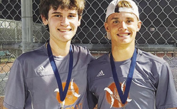 CONNOR HUGHSON and Waylon Chapman placed first in Boys Doubles at the Madisonville Mustang Invitational Varsity #2 Tournament.