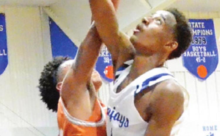 MA’DARIUS HAMILTON of Snook takes a shot as Caldwell’s Larry Davis tries to block it. -- Tribune photo by Roy Sanders
