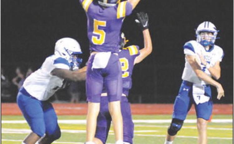 SNOOK’S J. BEAUX Hruska hurls this pass as Robert Carter blocks in the Weimar game. -- Tribune photo by Denise Squier