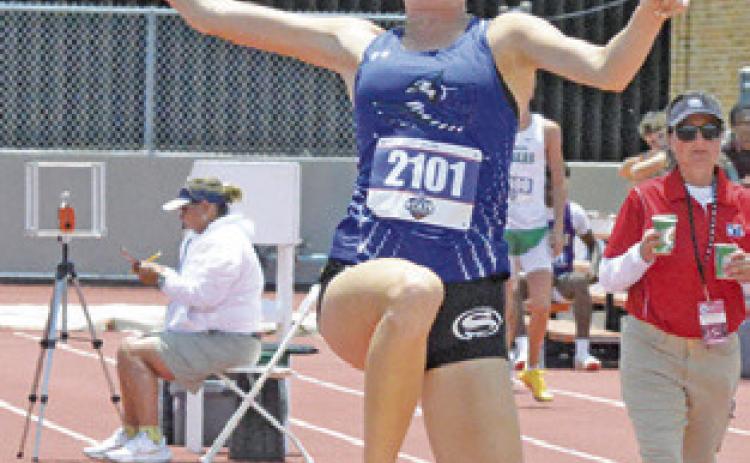 SNOOK’S DAKOTA KIENOW is pictured competing in the Class 2A girls triple jump during the UIL State Track &amp; Field Meet. Kienow and six other Snook athletes have qualified for the TAAF State Championships. Tribune photo by Denise Squier