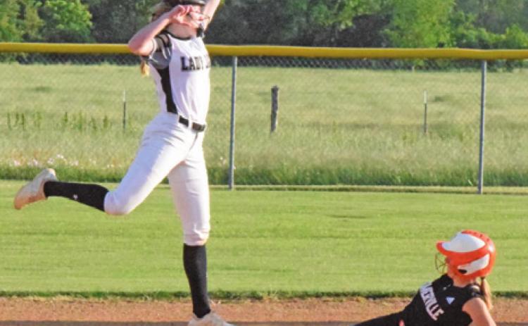 JAYCIE BRISCO LEAPS to catch the throw while Abigail Flencher slides safely into second base during the Snook-Somerville district game last Tuesday night in Snook. -- Tribune photo by Denise Squier