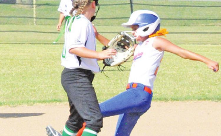 HARLOW FERGUSON slides safely into second during the team’s tournament game against Washington County last Saturday.