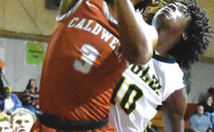 TRE BURNS of Caldwell takes a shot against Lexington. Caldwell won 57-48.