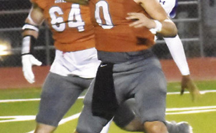 CALDWELL’S COY BECKA hurls this pass against Jarrell last Friday night.