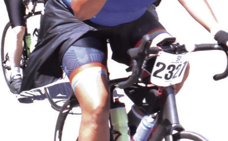 A BIKER ENJOYS the MS 150 bike ride on Sunday morning as it heads through Somerville. -- Tribune photo by Roy Sanders