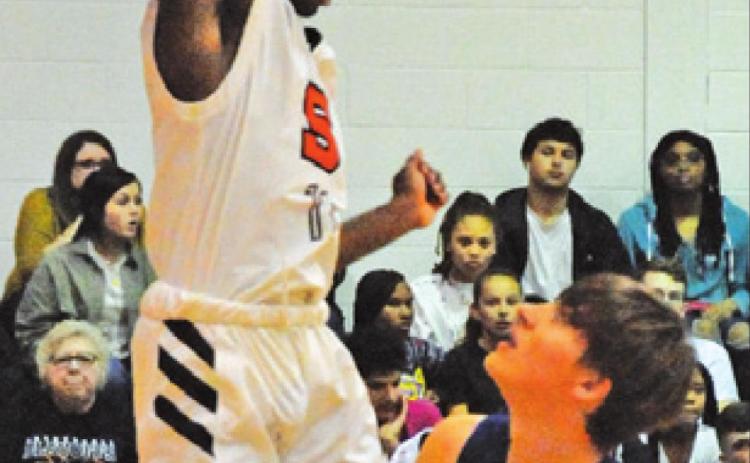 SNOOK’S SAM Smitherman gets ready to shoot as Somerville’s Hershel Conway defends. -- Tribune photo by Denise Squier