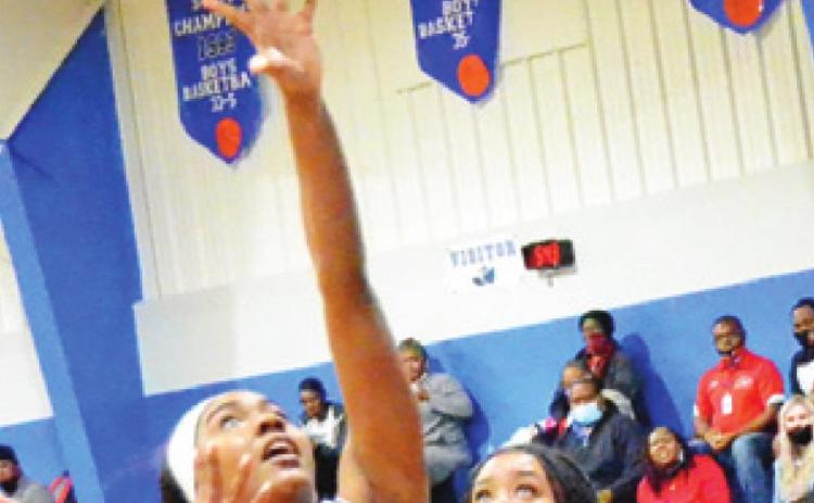 JAIVAN STRINGFELLOW shoots the ball while Mexia’s Jenny Williams looks on during the Lady Jays’ win over Mexia last Friday.
