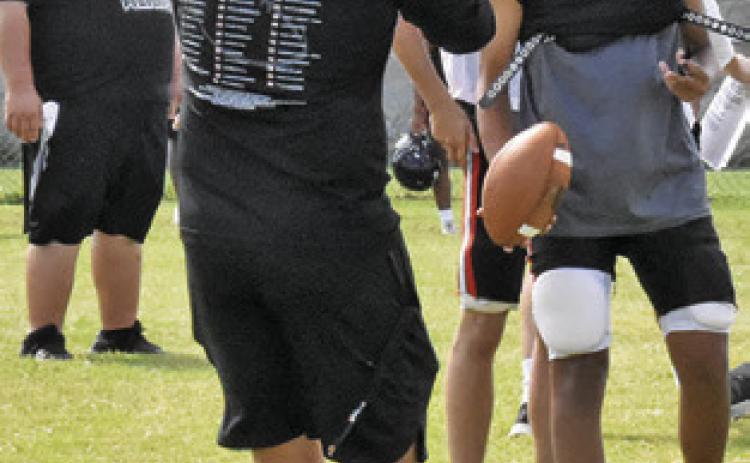 NEW SOMERVILLE Head Coach Luke Klingler talks to his players during a practice session.