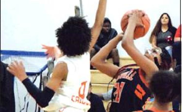 SOMERVILLE’S XADRIA Martin tries to shoot over Caldwell’s Ja’Asia Mathis during their game Saturday afternoon in Caldwell.