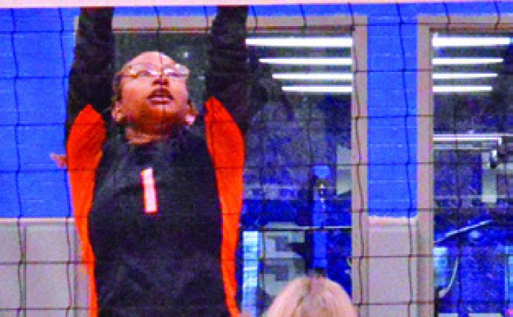 SOMERVILLE’S ALAZIA Vela reaches to attempt a block during the Lady Yeguas’ loss to Snook Friday. Also pictured is Aubrey Becker.