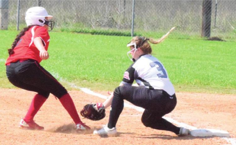 SNOOK’S LEIGHLA STRONG TAGS out a Burton runner at first base during the Lady Jays’ 13-5 victory over the Lady Panthers Wednesday afternoon in Snook. -- Tribune photo by Denise Hornaday