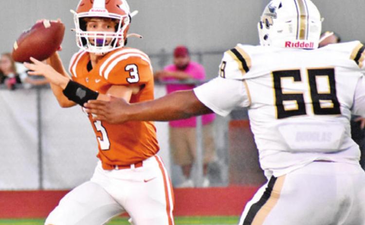 QUARTERBACK RYAN SHUPAK prepares to throw a pass.