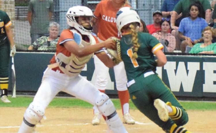 LADY HORNET CATCHER Aliyah Vela tags out a Lexington runner at the plate during Caldwell’s 5-3 loss to the Lady Eagles last Tuesday night at Lady Hornet Field. -- Tribune photo by Denise Squier