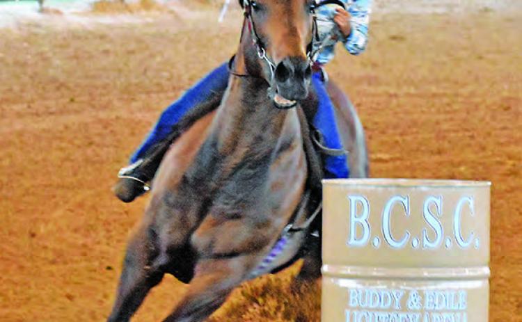 GIULIANA SCARMARDO COMPETES in the 9U Straight Barrels at the Burleson County Saddle Club Youth Rodeo in Caldwell.