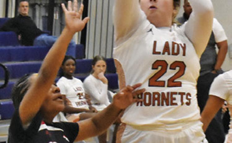 HANNAH RAE CLARK shoots during the recent Caldwell-Burton game at Hornet Gym. Tribune photo by Roy Sanders