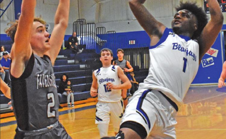 SNOOK’S KALEB CARROLL leans back to take this shot against Fayetteville. The Bluejays lost 59-54. -- Tribune photo by Roy Sanders