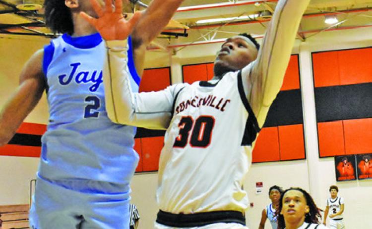 JA’KEITH DANIELS of Somerville takes a shot as Snook’s Jimmy Kearney tries to block the shot. Snook won 42-39. Tribune photo by Roy Sanders