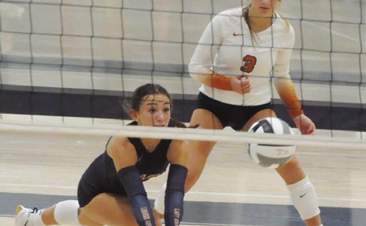 CALDWELL’S NATALIE EASTEPP lunges to get to the ball during Caldwell’s match against Klein Oak at last week’s Legends Invitational tournament in Bryan. Tribune photo by Denise Squier