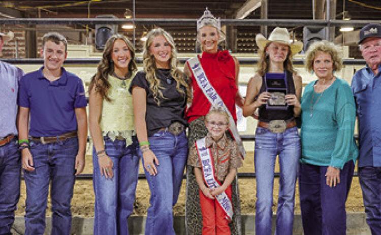 HALEY SEARS RECEIVES THE Christine Vogler memorial buckle, donated by Gary and Bridget Sebesta in memory of Vogler. Pictured, from left: Chad Vogler, Jackson Vogler, Kylie Vogler, Abby Vogler, Fair Queen Jolee Telschow, Little Miss Irene Kovar, Haley Sears, Bridget Sebesta and Gary Sebesta. Photo courtesy of Brandon Telschow