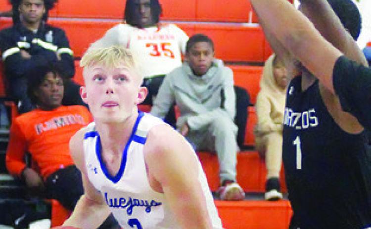 LIAM ZEQUEIRA of Snook prepares to shoot against the Brazos Cougars in the Schulenburg Tournament. -- Photo by Darrell Vyvjala of the Schulenburg Sticker