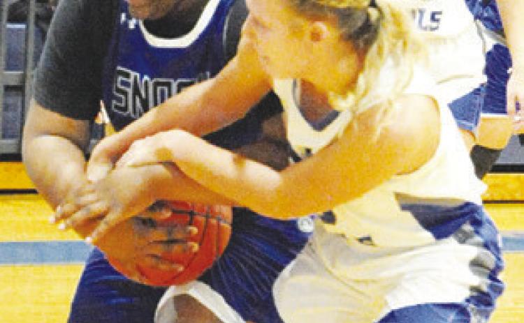 SNOOK’S MYKIA MUNSON FIGHTS with an Anderson-Shiro player for possession of the ball.