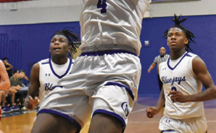 JOHN CARR of Snook takes a shot against St. Paul last Friday in Snook. Tribune photo by Roy Sanders