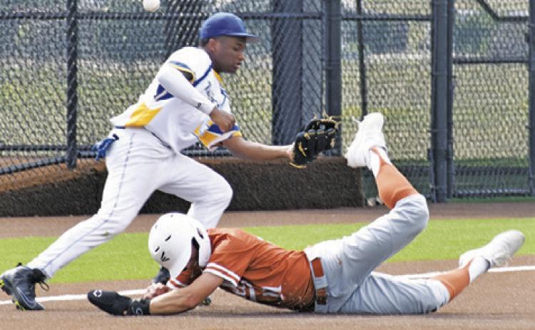 COY BECKA OF Caldwell slides into base against Houston Washington in the bi-district game.