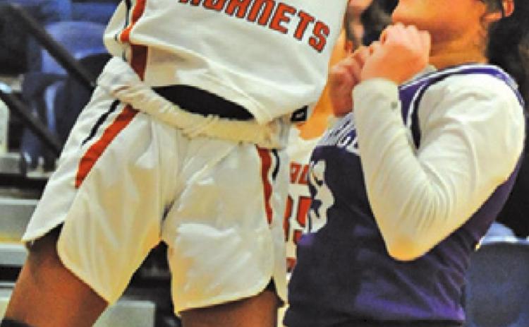 JAE MATHIS SHOOTS a basket during the Caldwell-Florence game last Friday. Mathis scored 17 points in the Lady Hornet win.