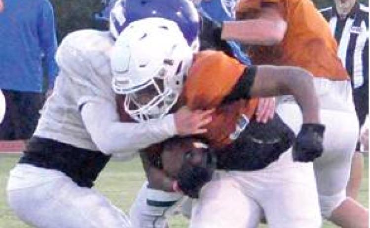 KRIS CARROLL carries the ball last Friday against Robinson in the Hornets first scrimmage. -- Tribune photo by Roy Sanders