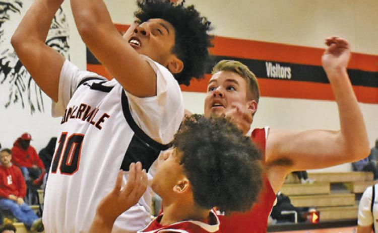 JORDAN SMITH OF Somerville takes a shot against Burton. Tribune photo by Roy Sanders