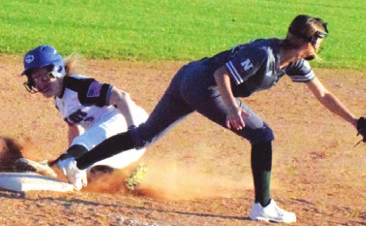 SNOOK’S LEIGHLA STRONG slides into third base during Snook’s game against Normangee last Friday afternoon. Normangee won the District 26-2A matchup won 28-4. -- Tribune photo by Denise Hornaday