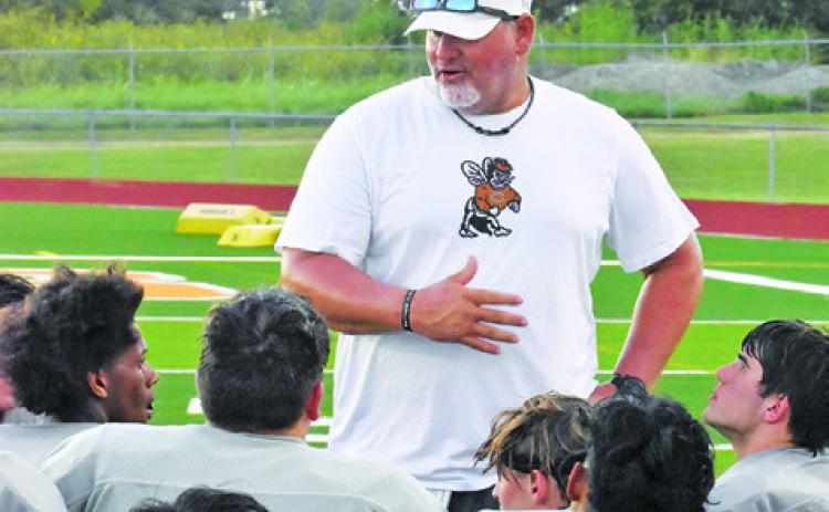 CALDWELL HEAD COACH Sean Witherwax addresses his team after the Anderson-Shiro scrimmage. -- Tribune photo by Roy Sanders